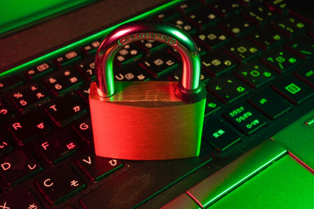 A hardened padlock on a keyboard, representing cyber security protection
