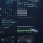 inux terminal windows showing system output and code on a monitor