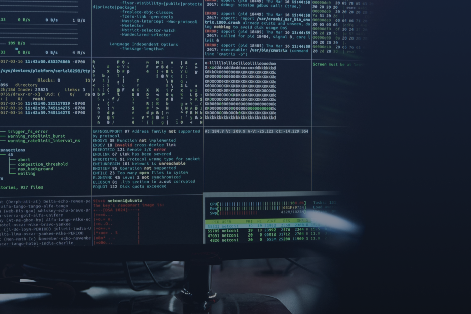 inux terminal windows showing system output and code on a monitor